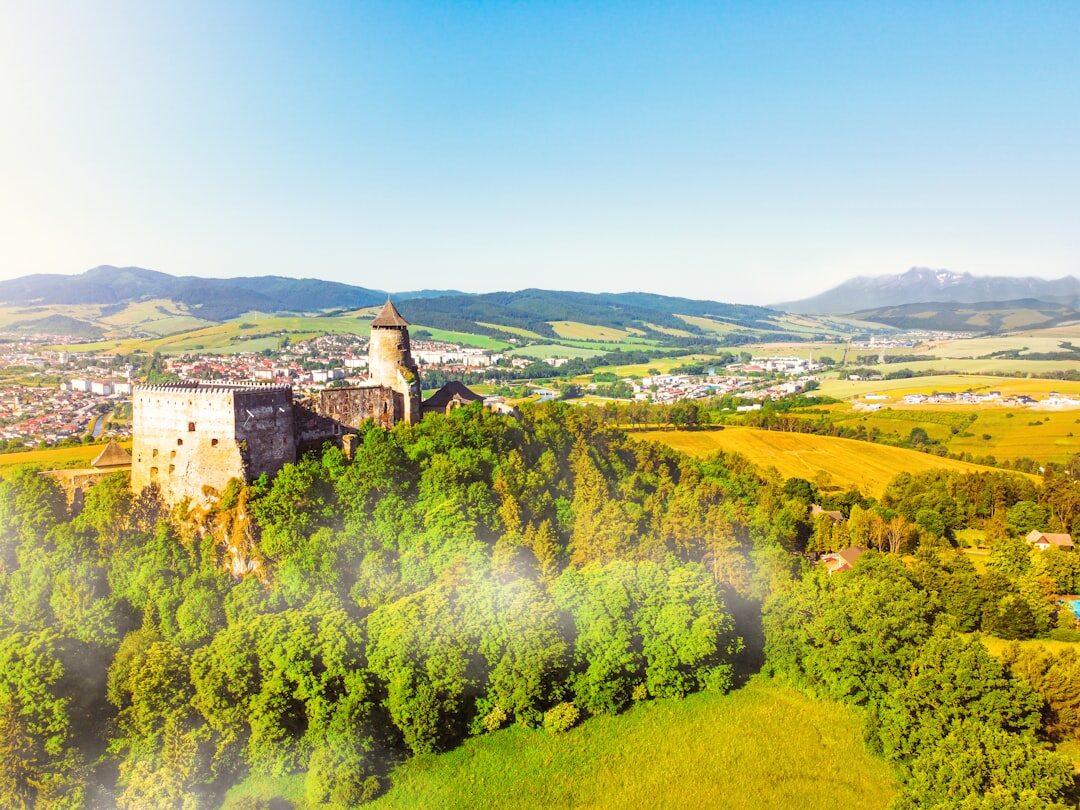 Group of seniors visiting a historic castle in Slovakia