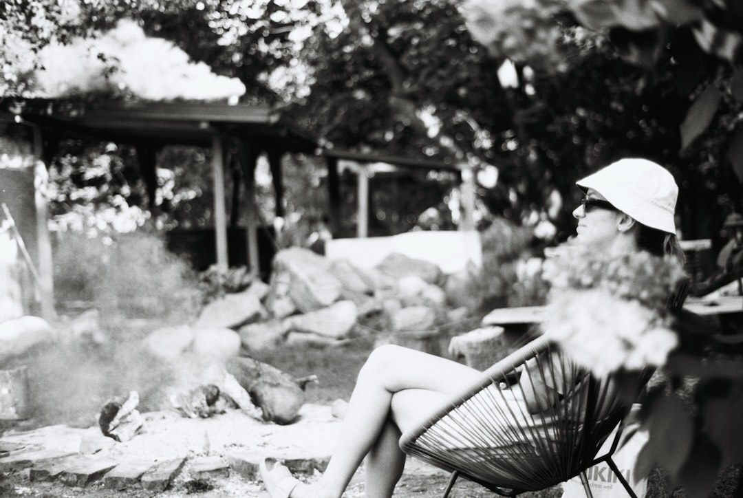 senior reading book in garden